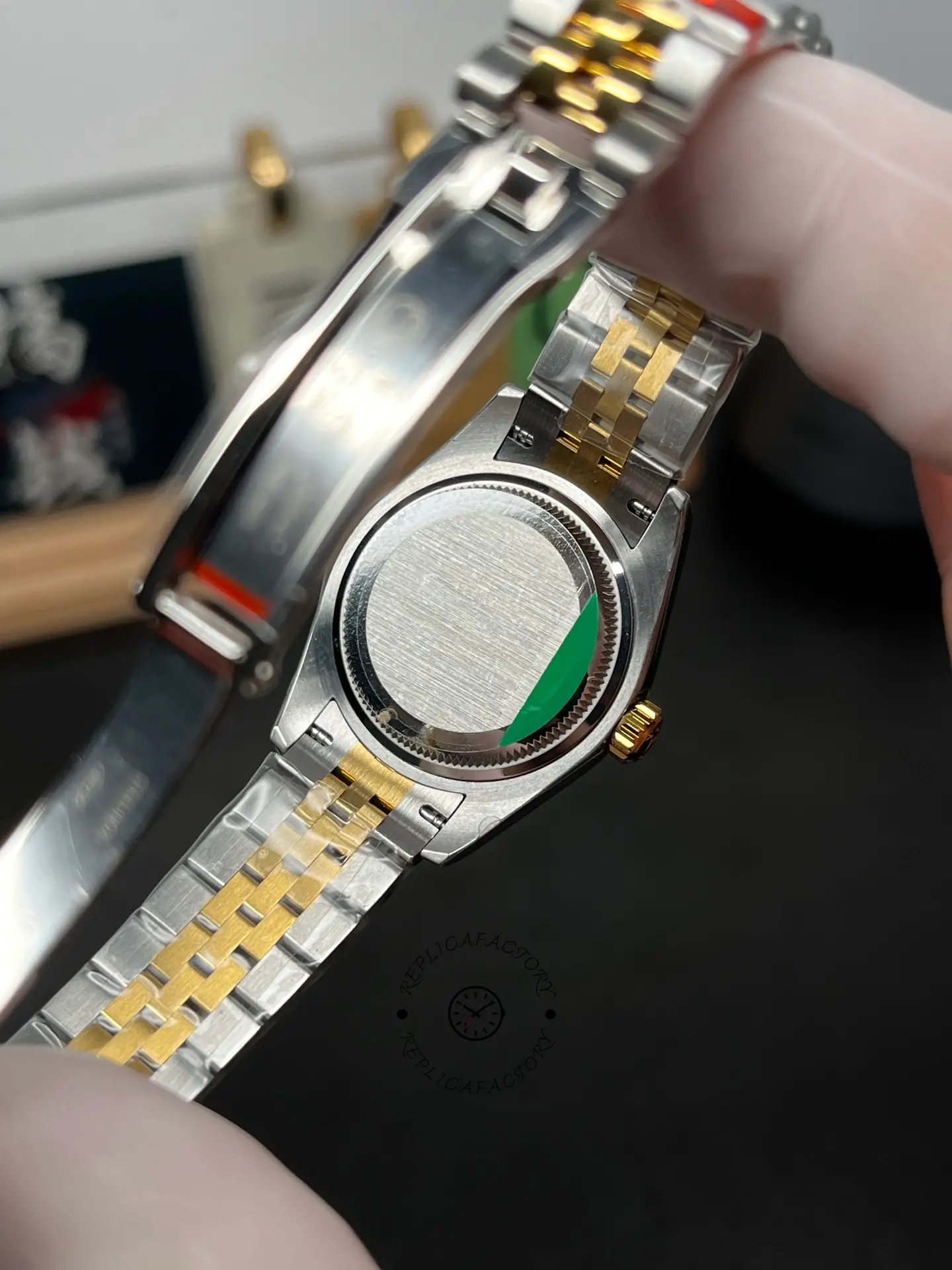 Rear view of Rolex Lady-Datejust 279173-0021 showing the solid case back and opened clasp.