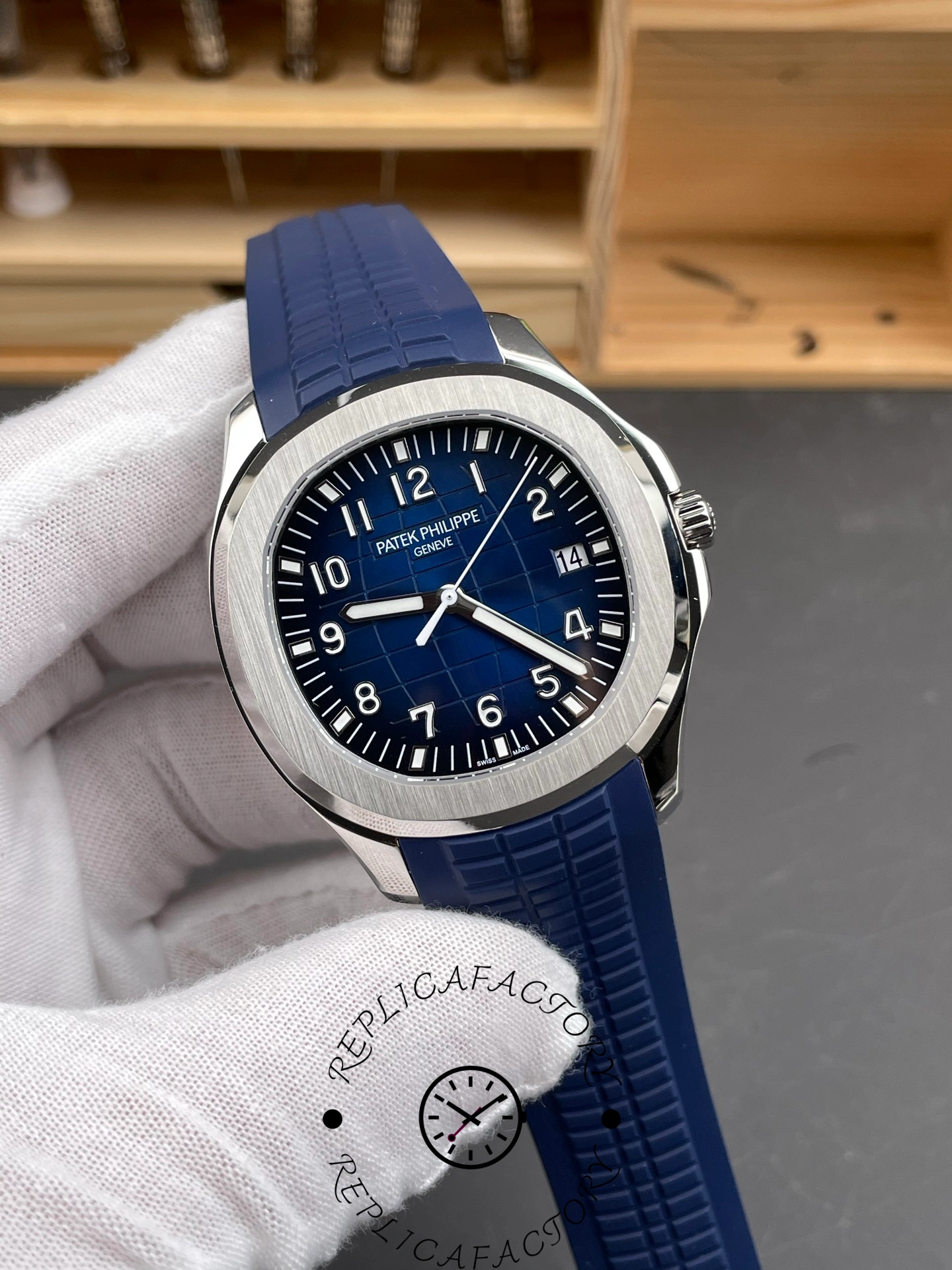 Angled view of Patek Philippe 5168G-001 1:1 clone showing case finishing and blue rubber strap.