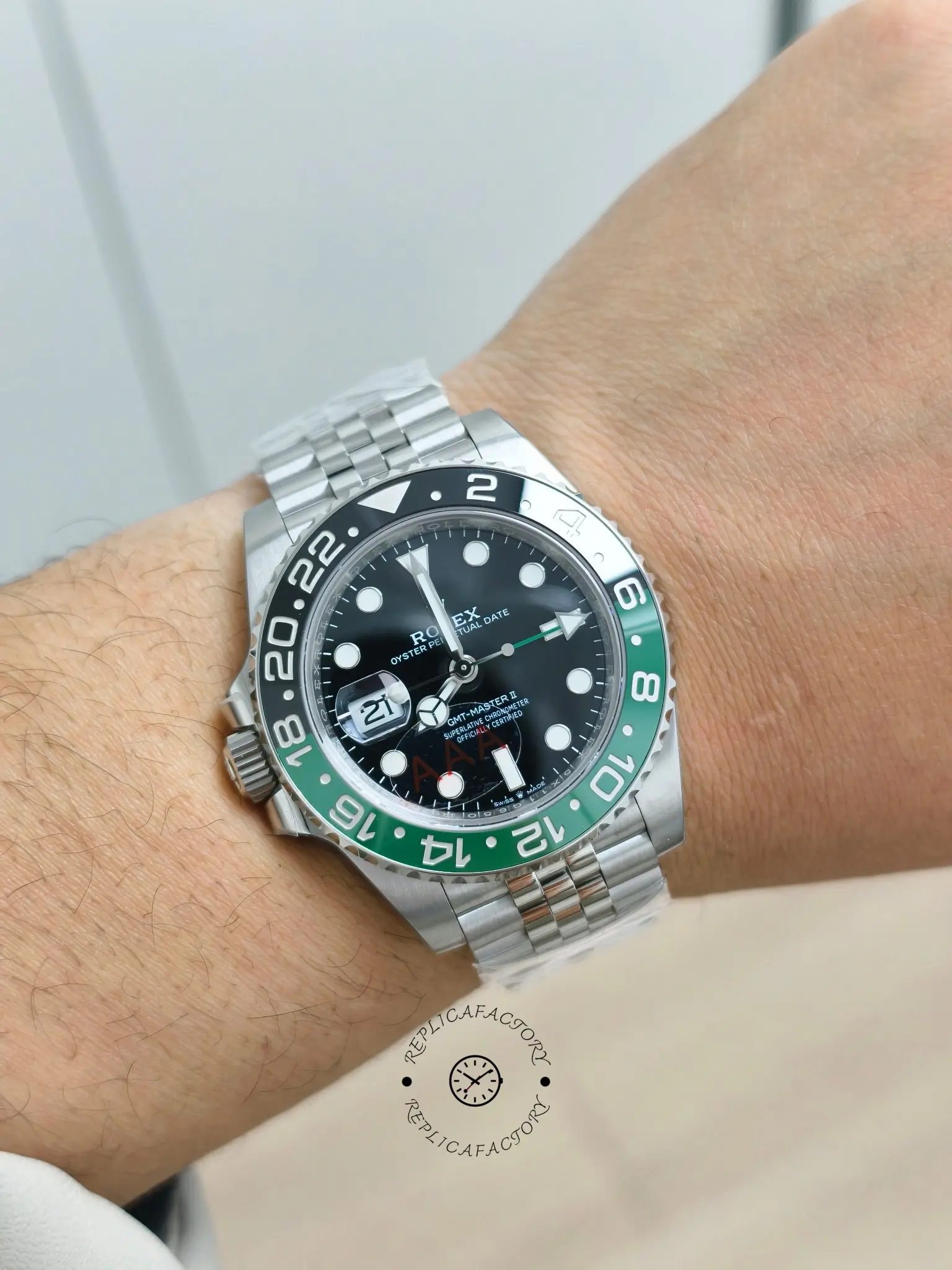 Wrist shot of Rolex GMT-Master II 126720VTNR showing black dial, Jubilee bracelet, and black-green bezel.