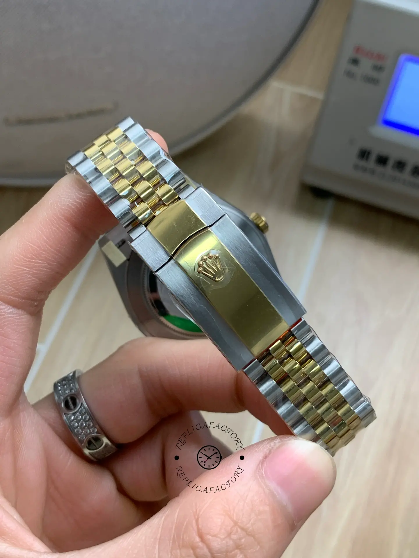 Closed clasp rear view of Rolex Datejust 41 126303-0010 showing clasp logo and two-tone Jubilee bracelet.