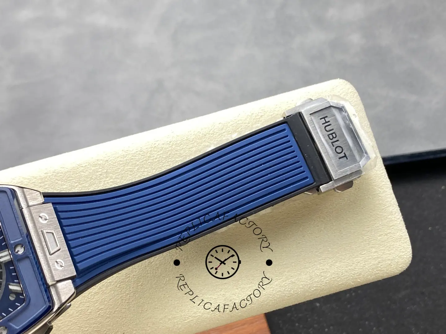 Strap clasp detail of Hublot 642.NL.7170.RX showing signed deployant clasp on the rubber strap.