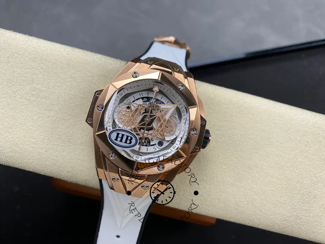 Full watch on cushion of Hublot 418.OX.2001.RX.MXM20 showing dial, bezel screws, and strap.