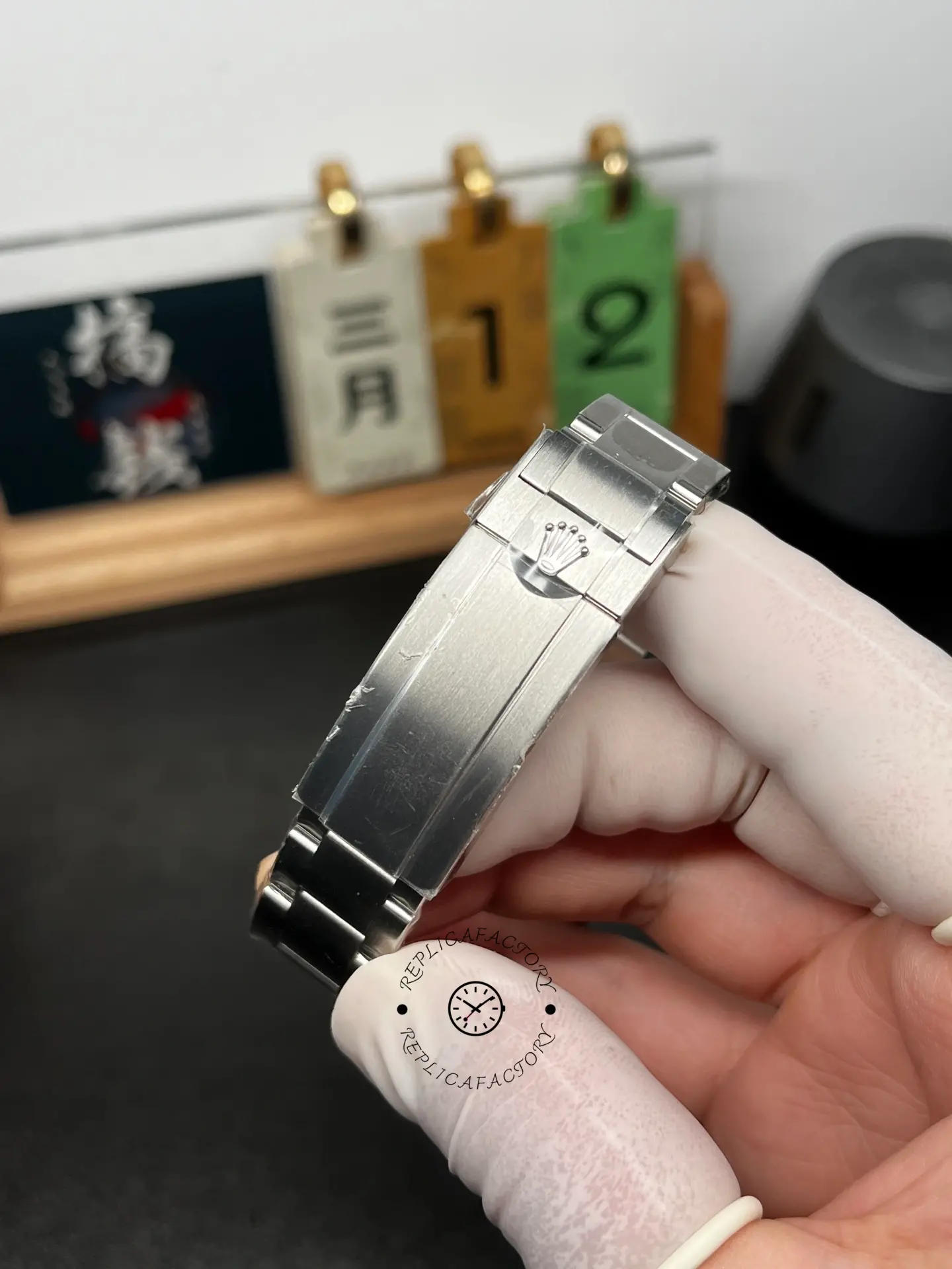 Clasp close-up of Rolex Submariner 124060 Oyster bracelet with brushed clasp and crown emblem.