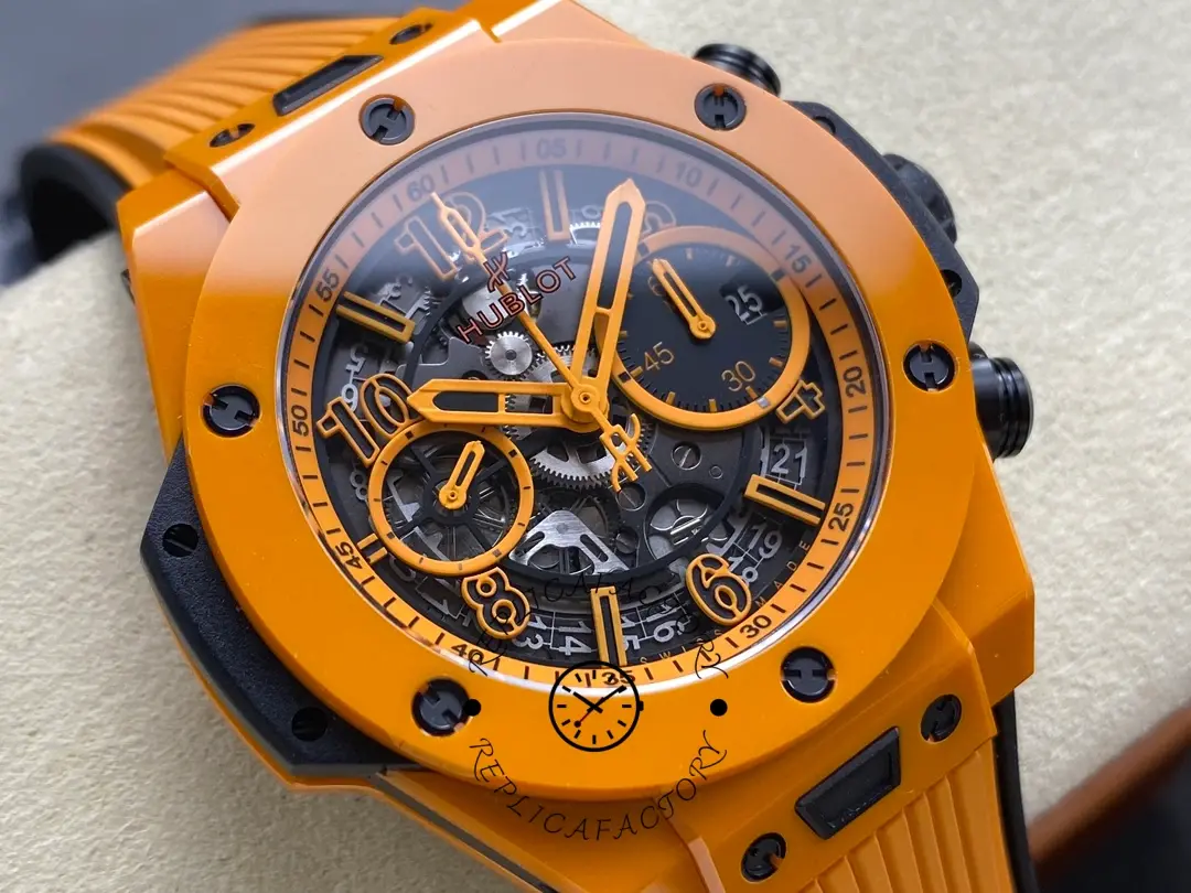 Angled dial close-up of Hublot 441.CU.5910.RX showing orange hands, chronograph subdials and date window.