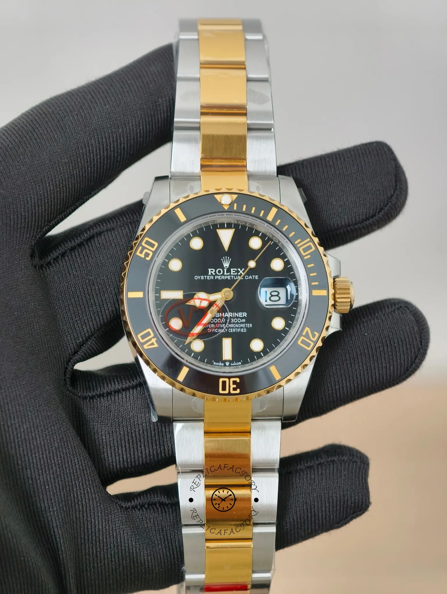 Angled front view of Rolex Submariner Date 116613 replica with black dial and two-tone Oyster bracelet.