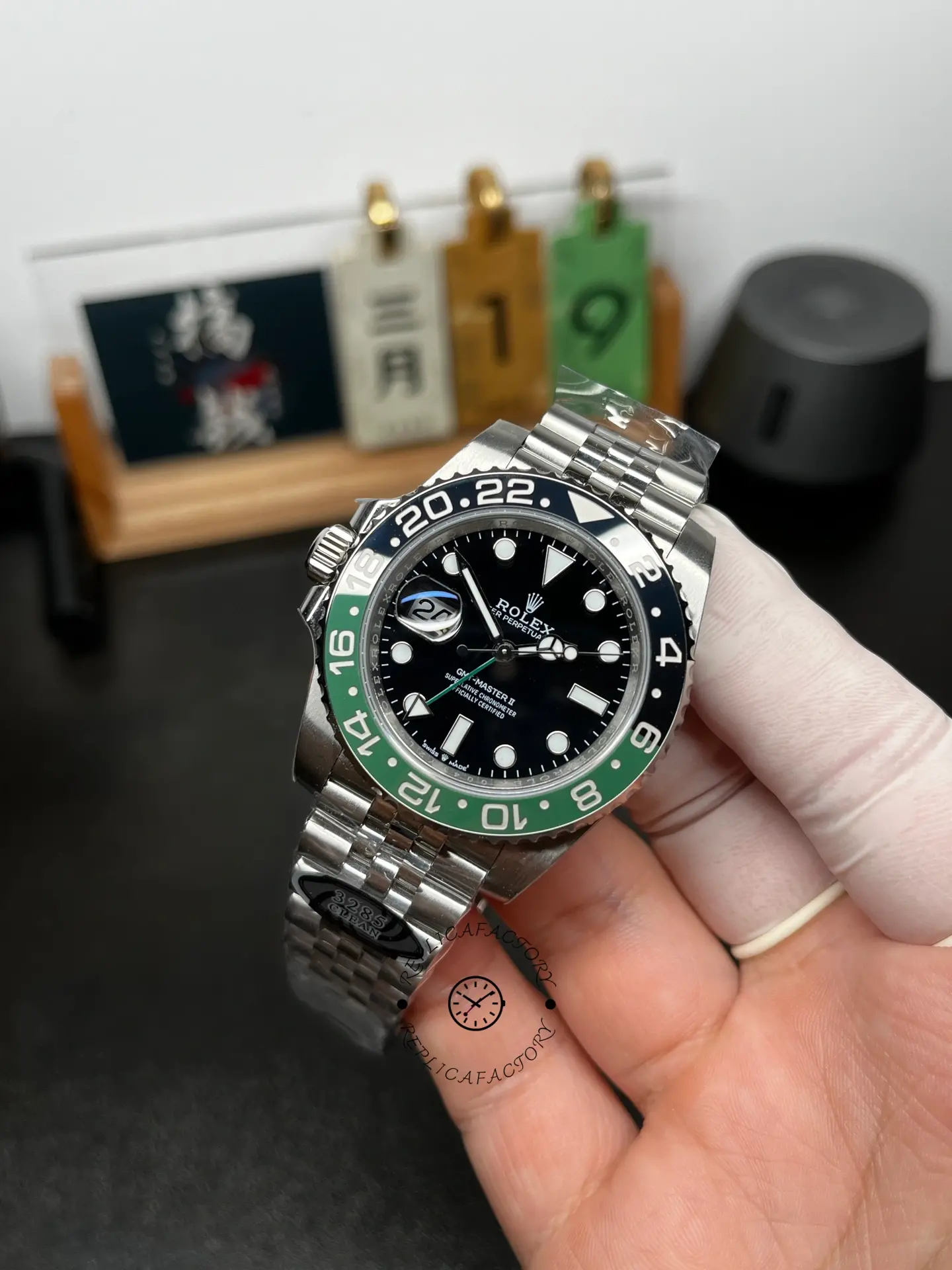 Angled front view of Rolex GMT-Master II 126720VTNR with black dial and green-black bezel insert.