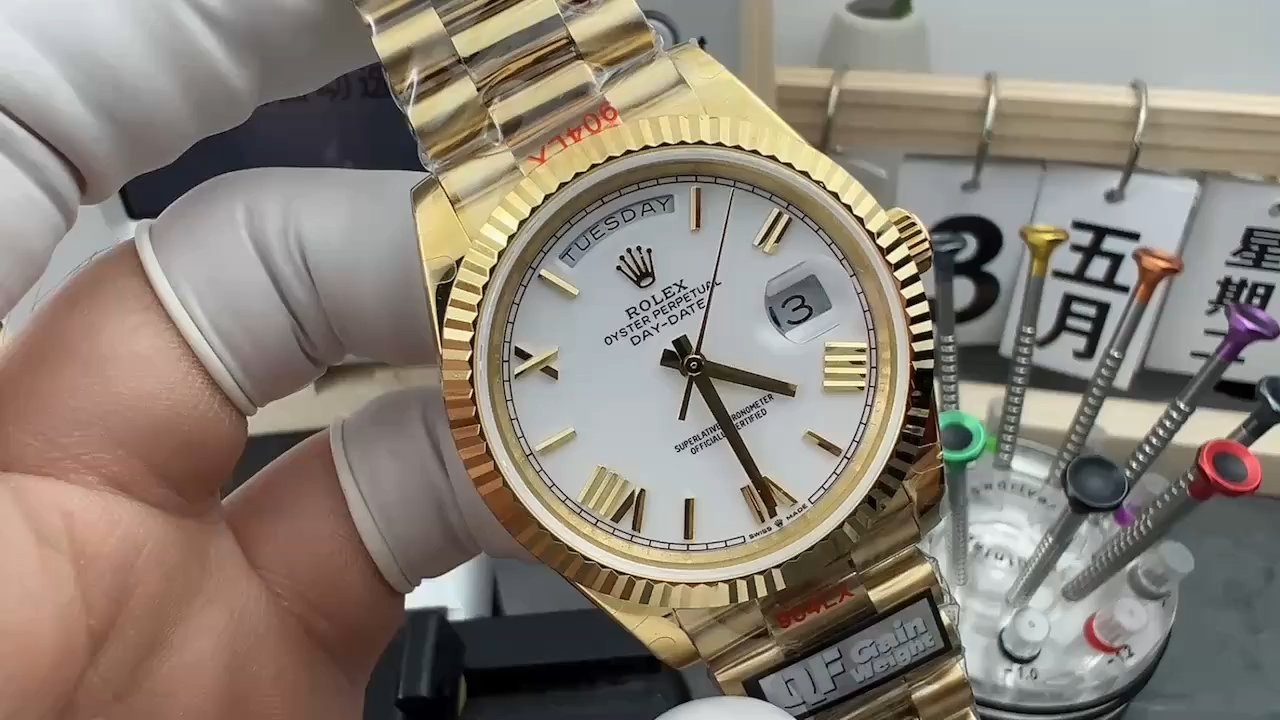 Front view of Rolex Day-Date 128238 with white Roman dial, fluted bezel and yellow gold case. - Video