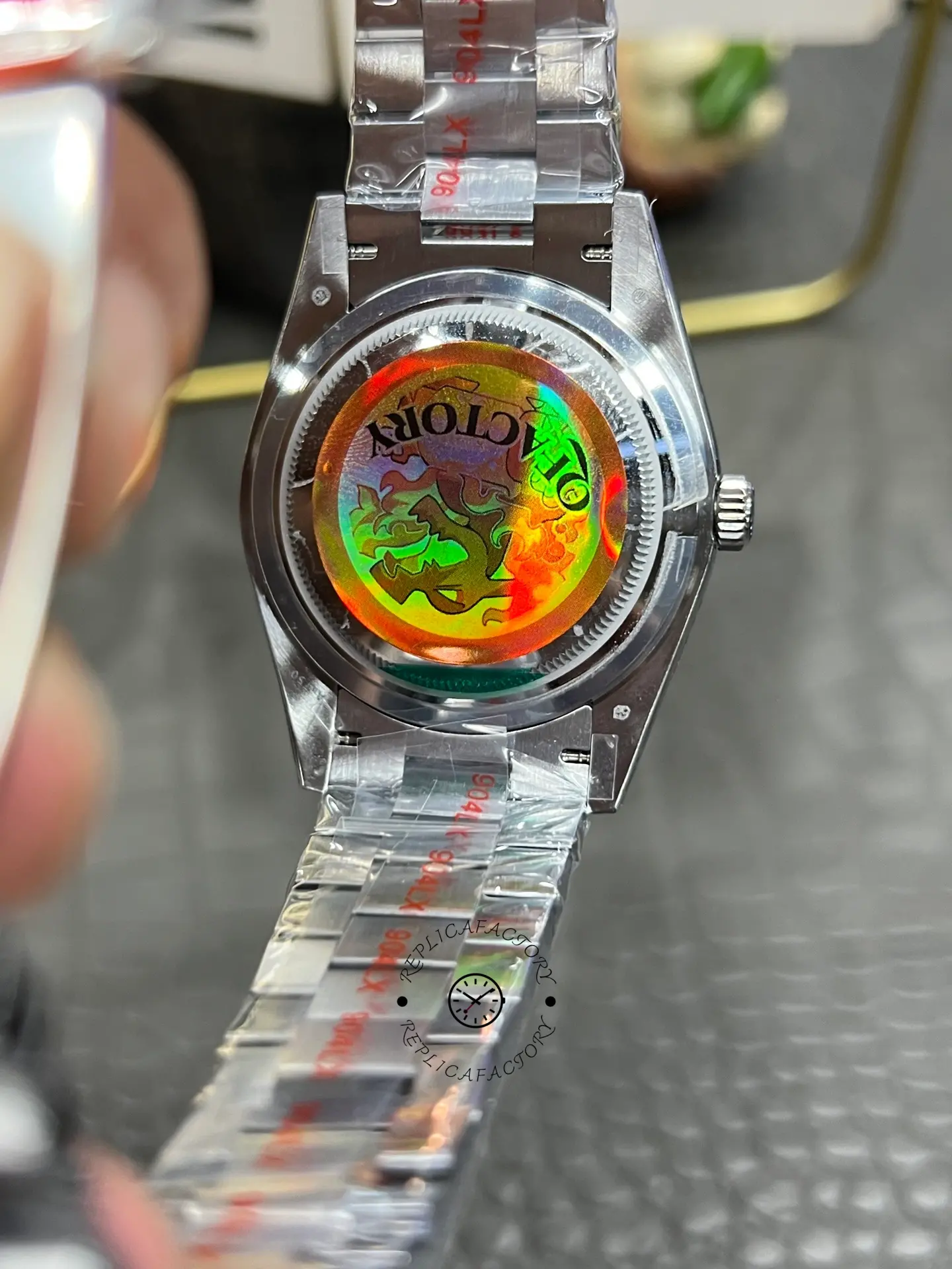 Caseback view of Rolex Day-Date 228239-0076 showing the solid back and bracelet interior.