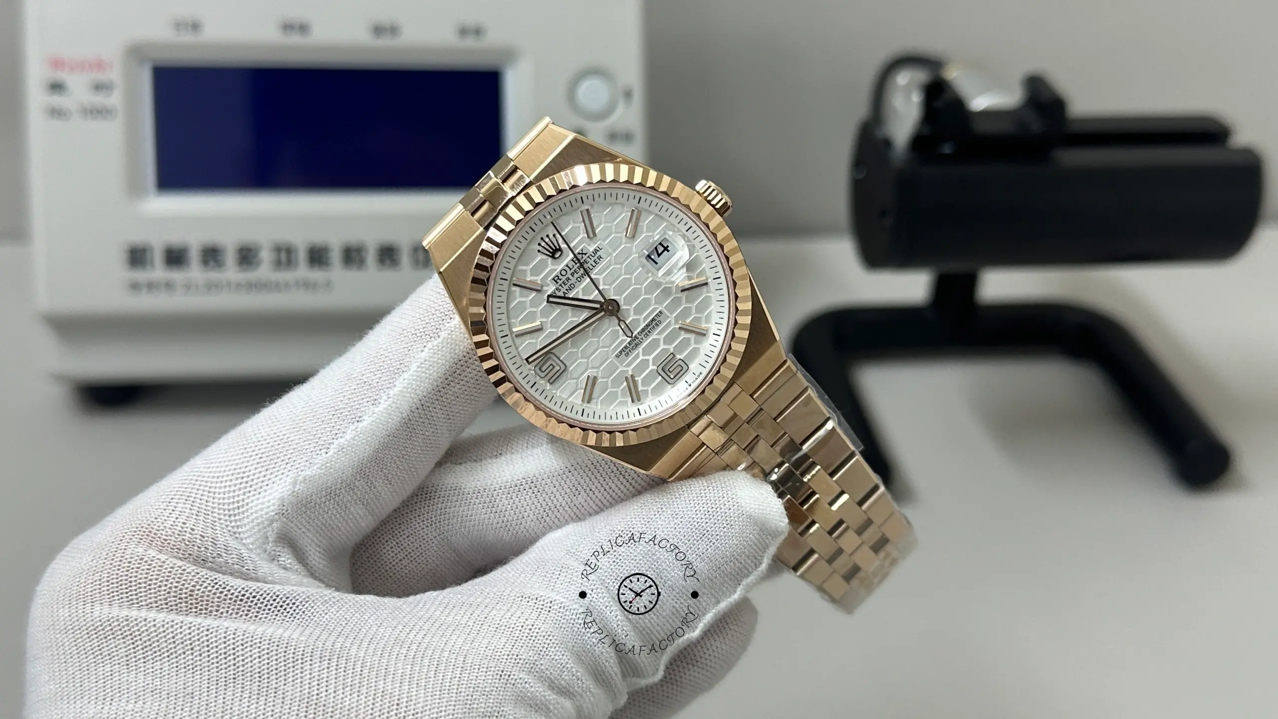 Angled front view of Rolex Land-Dweller M127235-0001 showing the honeycomb dial and integrated rose gold bracelet.
