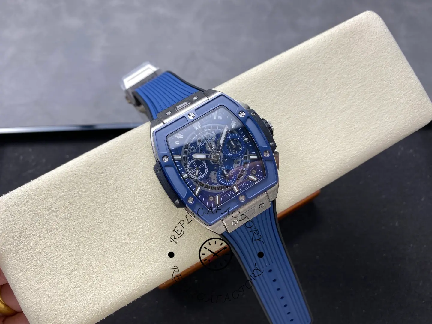 Full front view of Hublot 642.NL.7170.RX on display pad showing blue skeleton dial and strap.