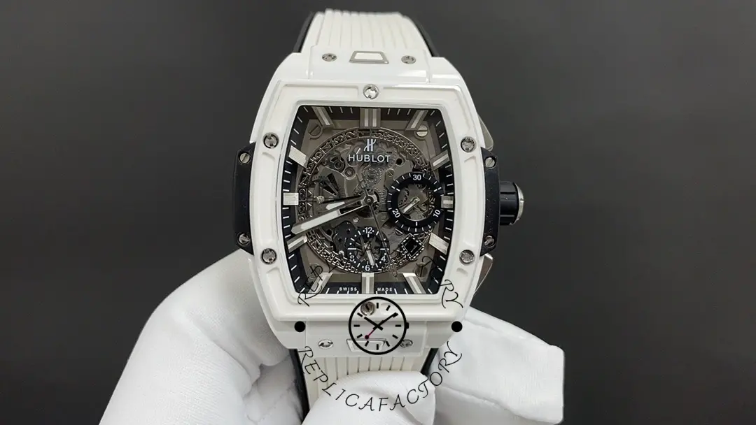 Studio front shot of Hublot Spirit of Big Bang 642.HX.0170.RX held in glove, highlighting skeleton dial and subdials.