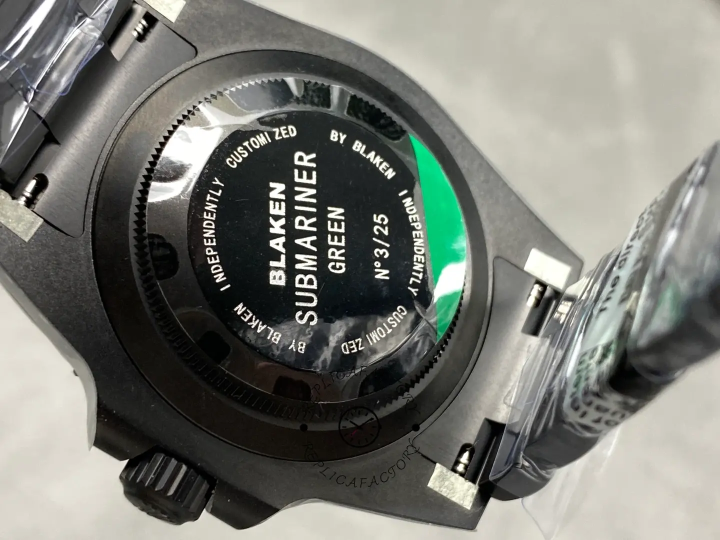 Caseback of Rolex Submariner 116610LV showing engraved Blaken Submariner detail.