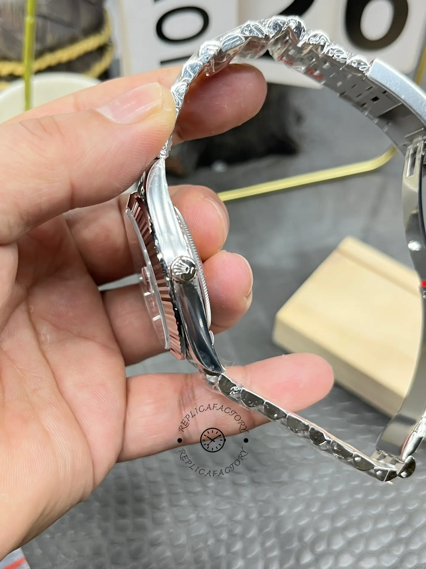Side profile of Rolex Datejust 126334-0022 showing the signed crown and slim case profile.