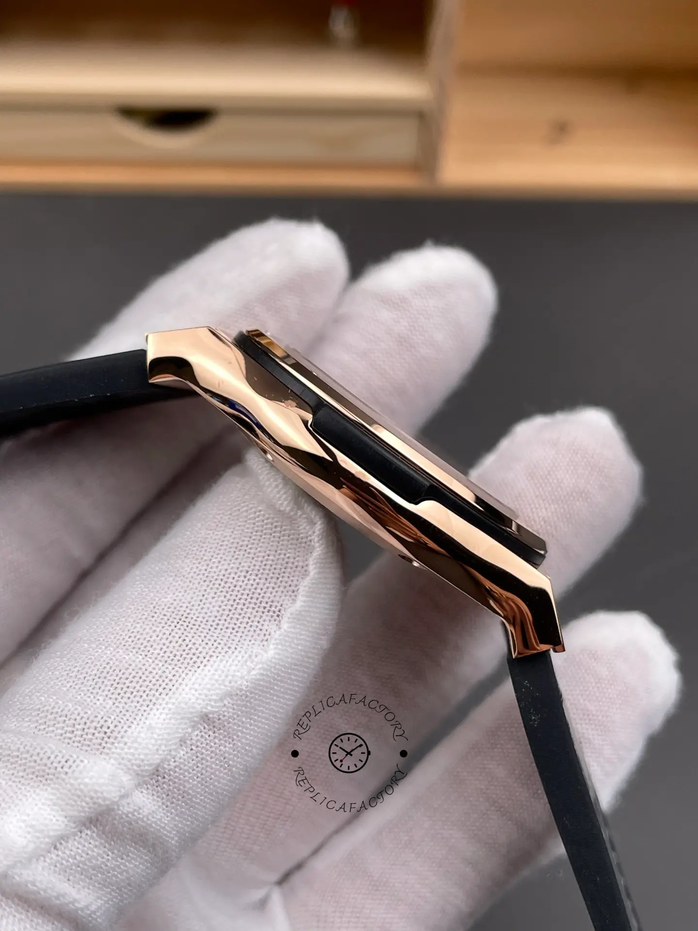 Side profile of Hublot Classic Fusion King Gold 542.OX.1181.RX 42mm showing slim case and black rubber strap.