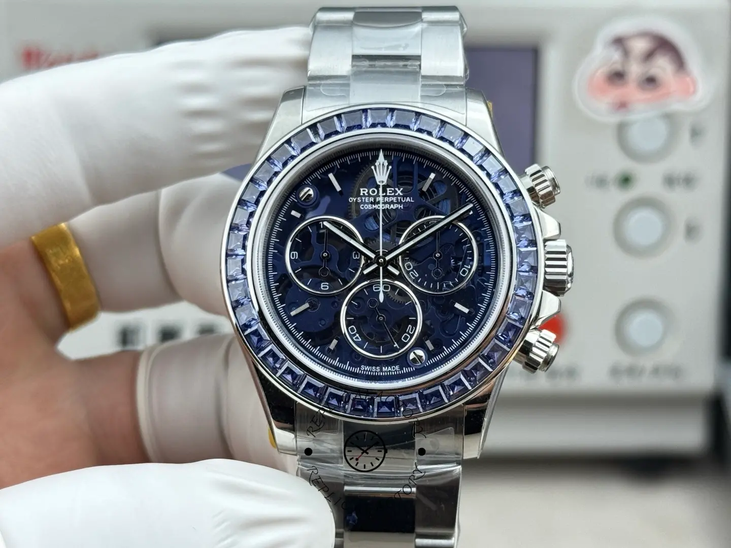 Front view of the Rolex Daytona Arolla Glacier clear dial replica with blue dial and baguette-style bezel.