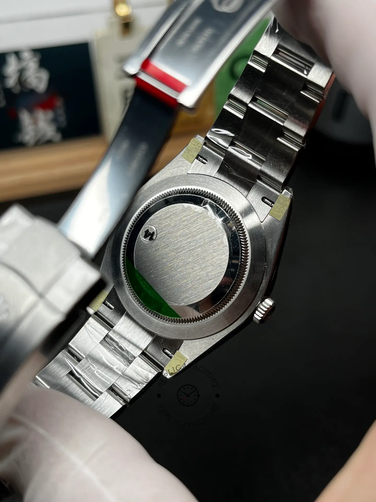 Back view of Rolex Oyster Perpetual 41 134300-0004 showing solid screw-down caseback and bracelet interior.