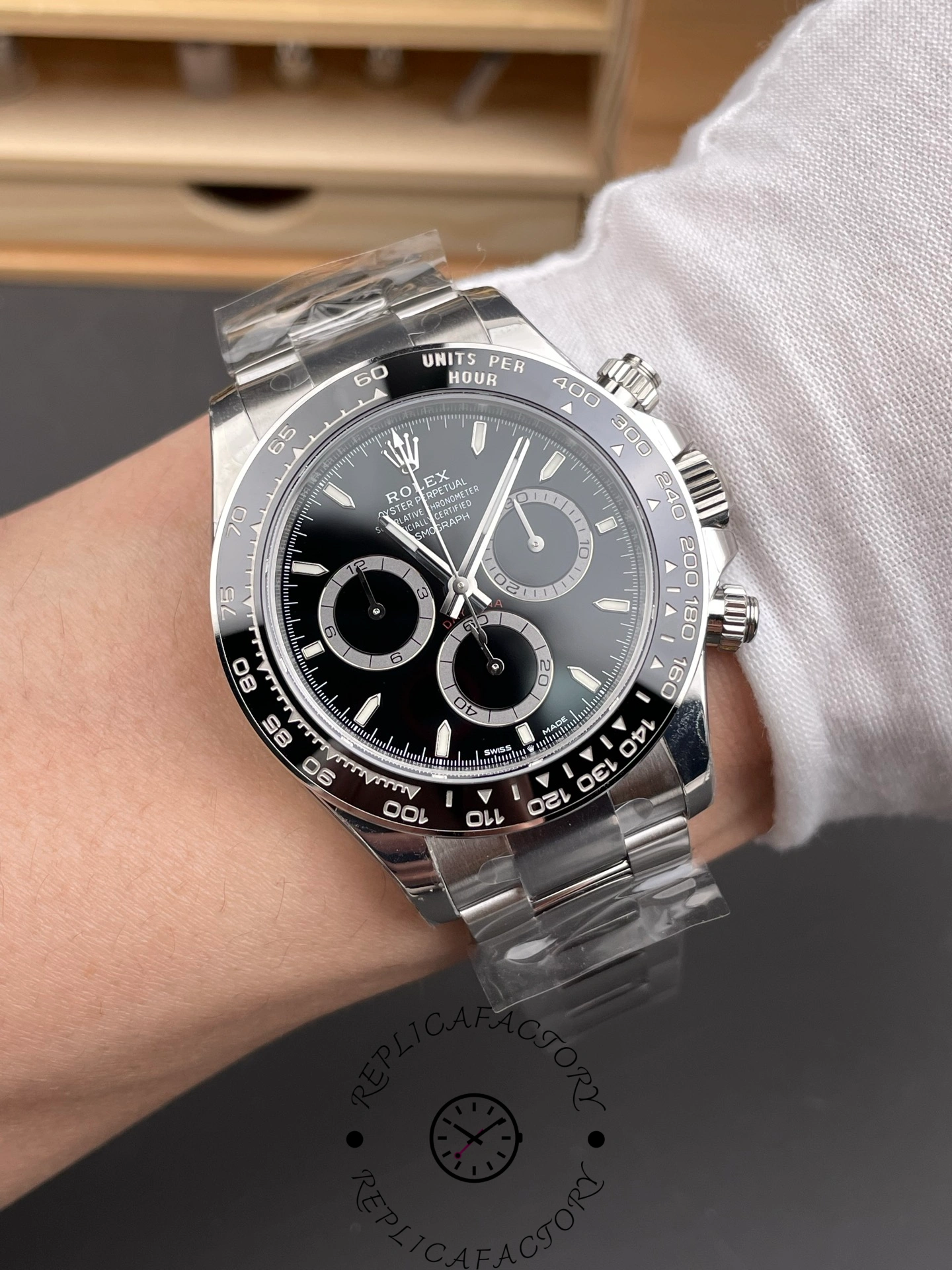 Wrist shot of Rolex Cosmograph Daytona m126500LN-0002 with black dial and ceramic bezel.