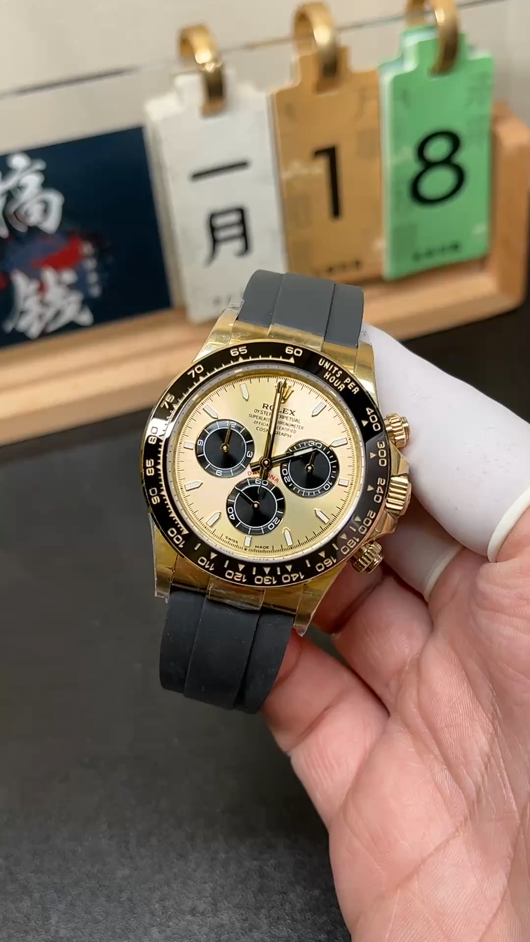 Video of Rolex Daytona 126518LN-0012 held in hand with black Oysterflex strap. - Video