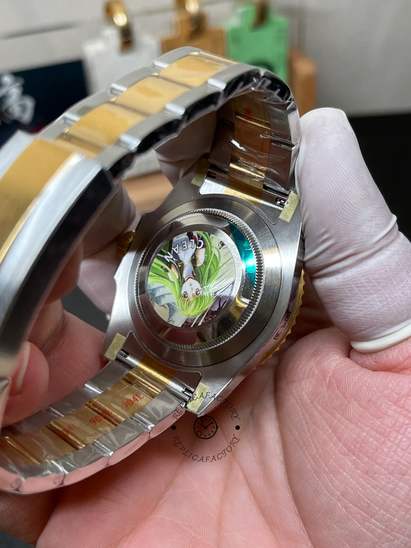 Case back view of Rolex Submariner 126613LN-0002 replica with solid back and two-tone Oyster bracelet.