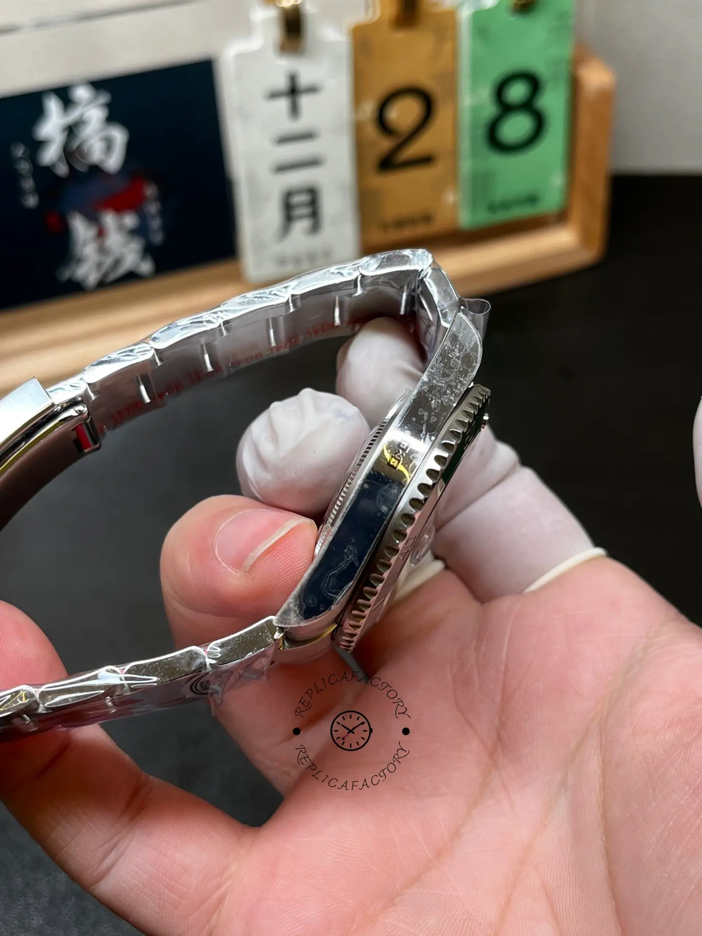 Side profile of Rolex 116610LV Submariner Date showing the polished case side and bezel teeth.