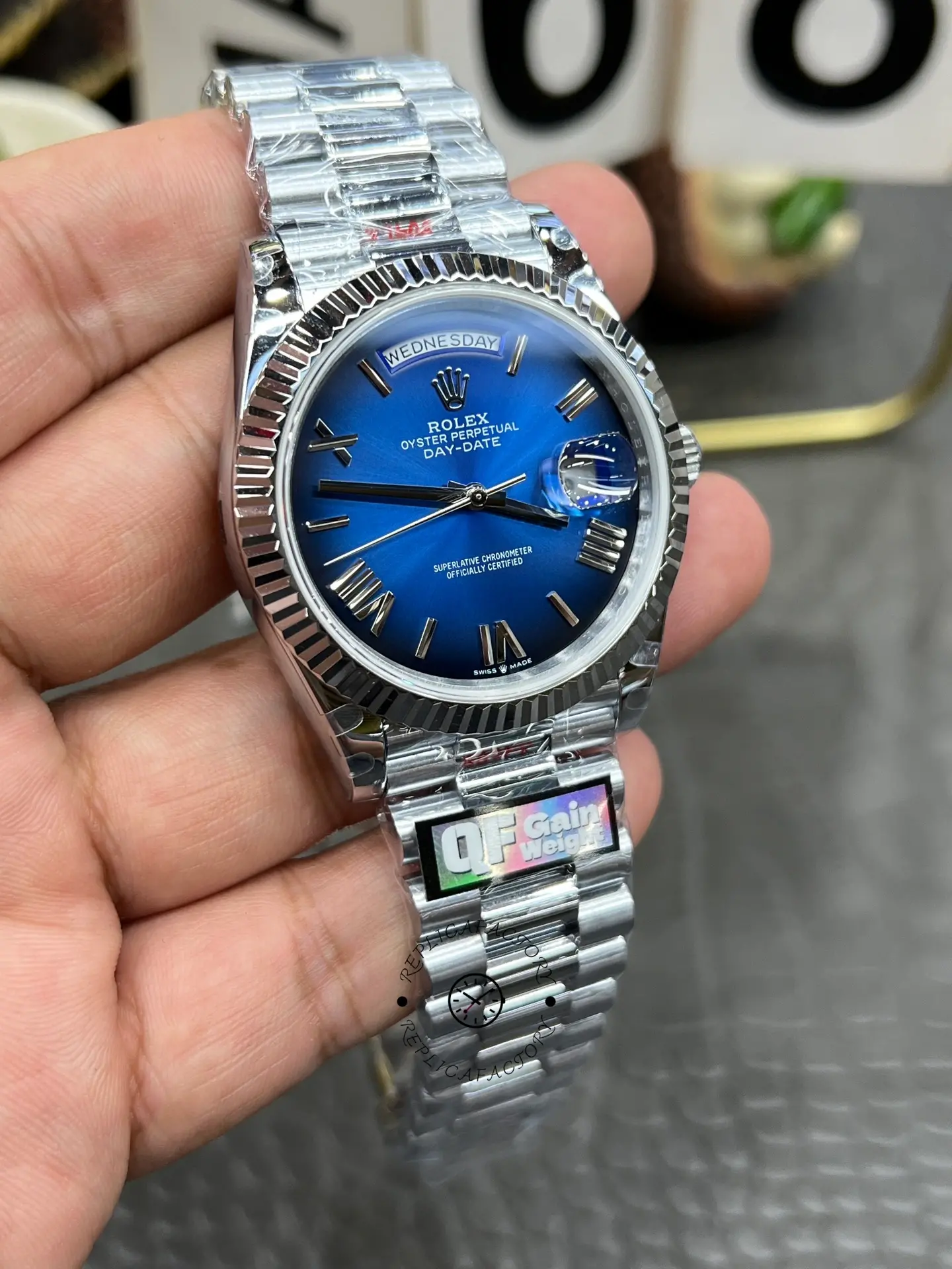 Front angle of Rolex Day-Date 228239-0076 highlighting the blue ombré dial and Cyclops date lens.