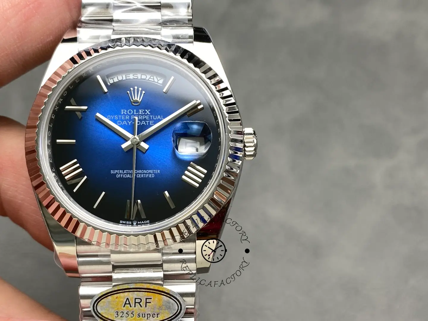 Rolex Day-Date 228239-0076 front dial view showing Roman numerals and fluted white gold bezel