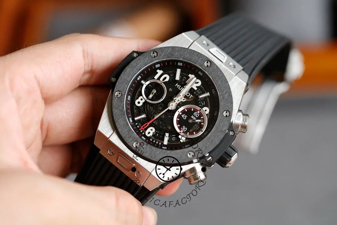 Handheld full watch view of Hublot Big Bang Unico 411.NM.1170.RX, black bezel and pushers shown.