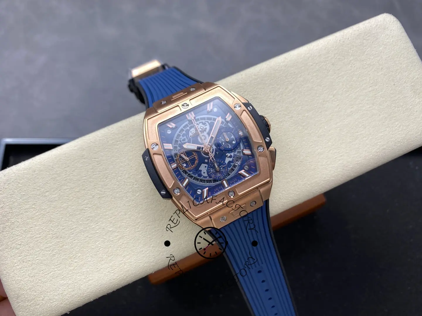 Full watch on cushion: Hublot Spirit of Big Bang 642.OX.7180.RX showing blue strap and case shape.