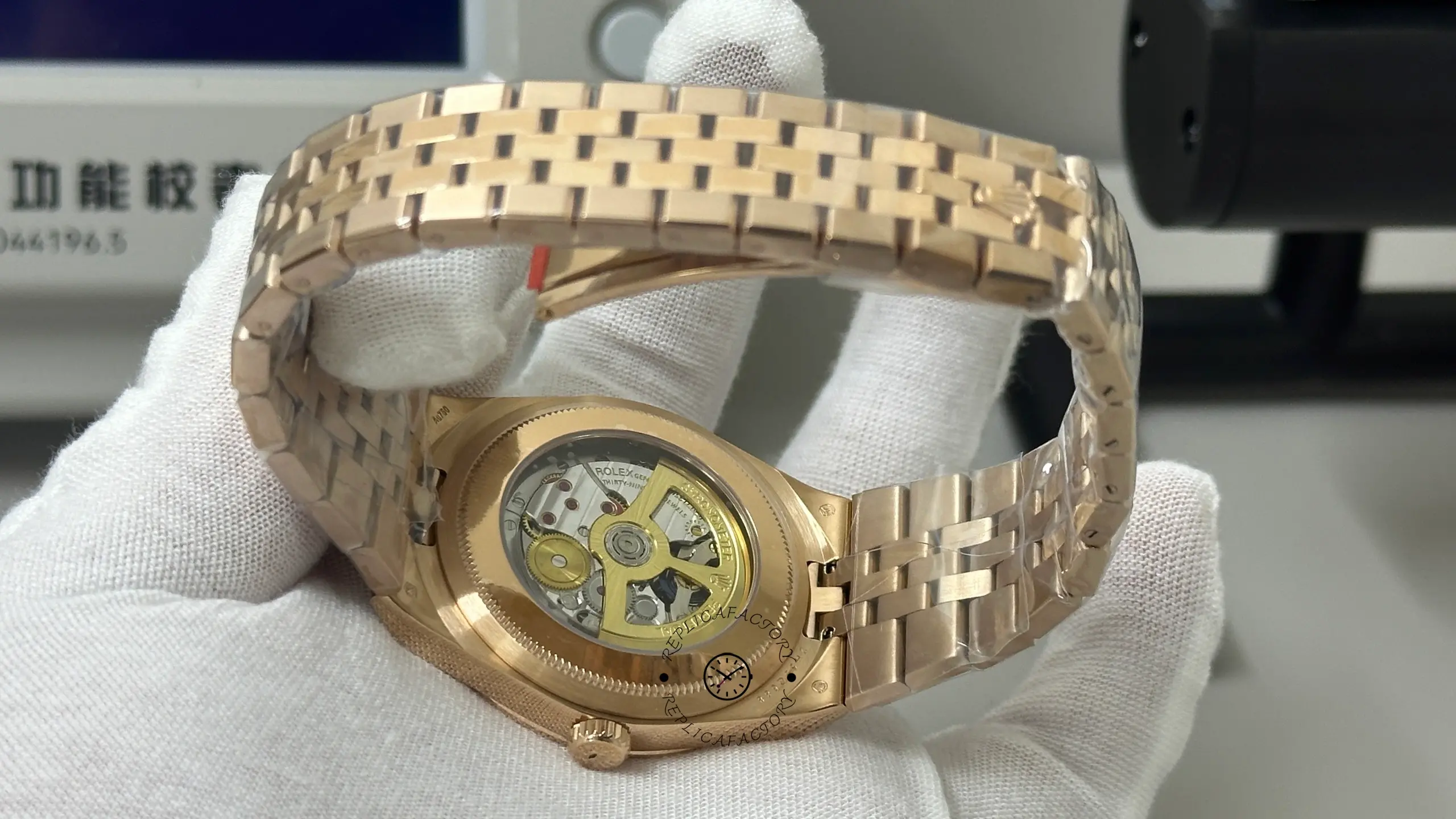 Rear view of Rolex Land-Dweller M127235-0001 showing the exhibition case back and integrated rose gold bracelet.