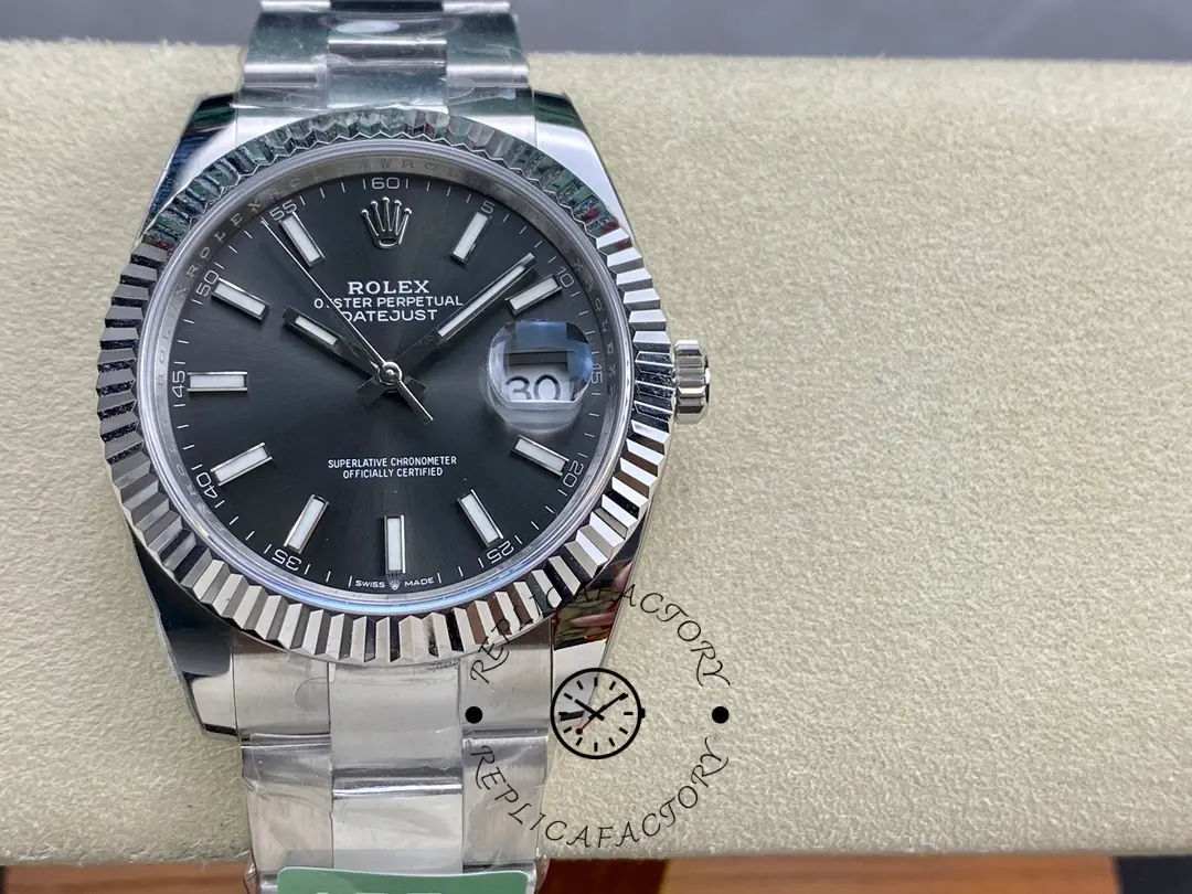 Front display of Rolex Datejust M126334-0013 on cushion with slate dial and Oyster bracelet.