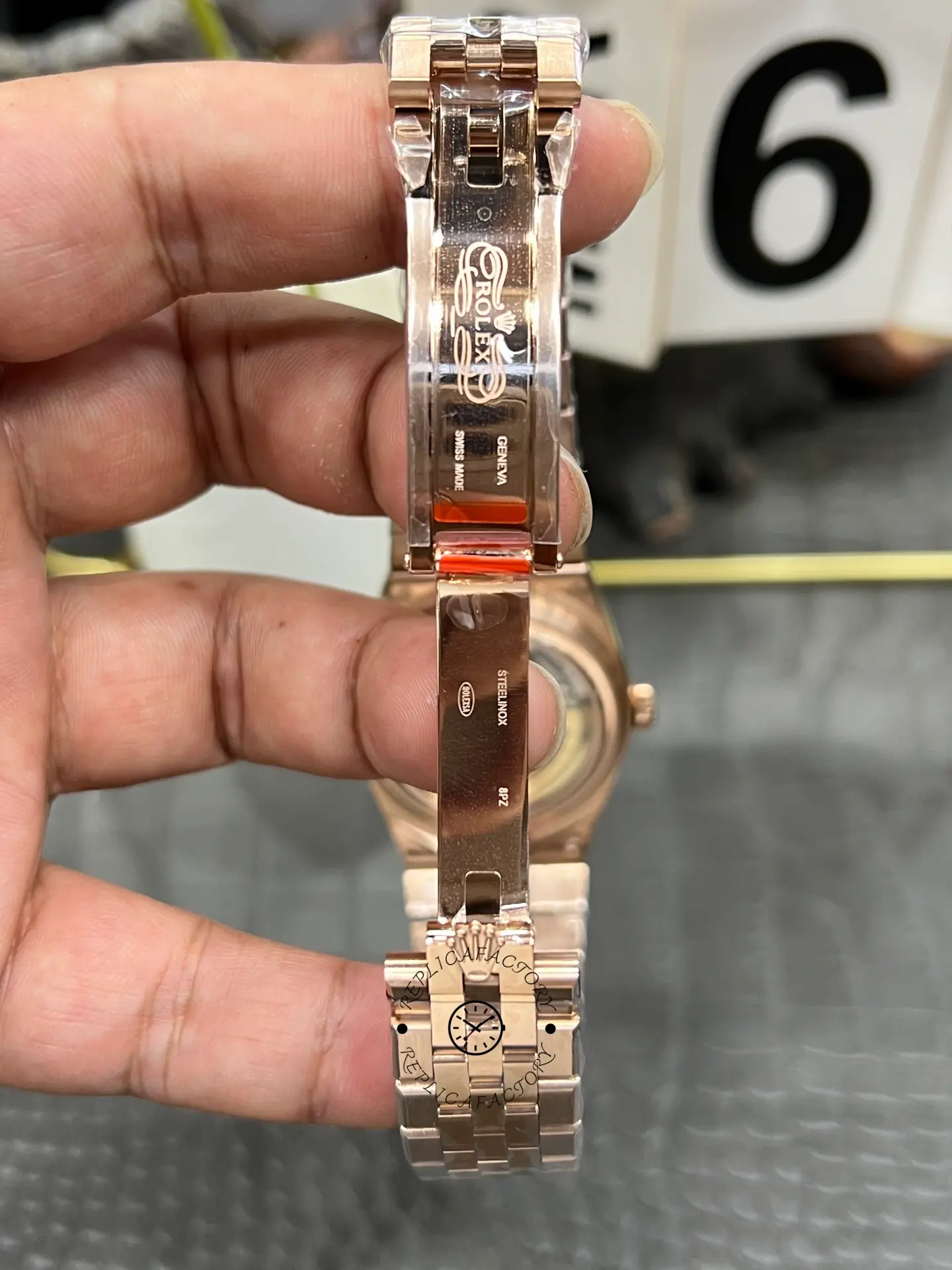 Inside clasp view of Rolex Land Dweller m127385tbr-0003 showing the folding clasp interior and engravings.