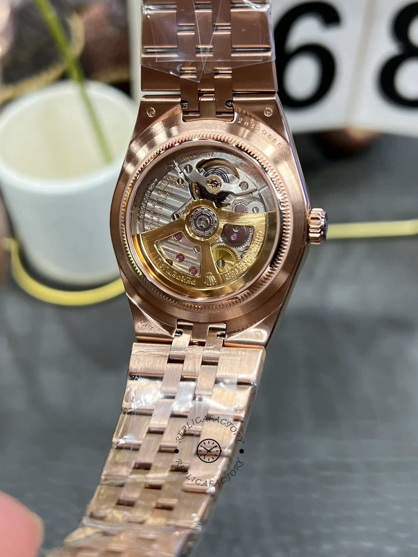 Exhibition caseback view of Rolex Land Dweller m127385tbr-0003 showing the visible automatic movement.