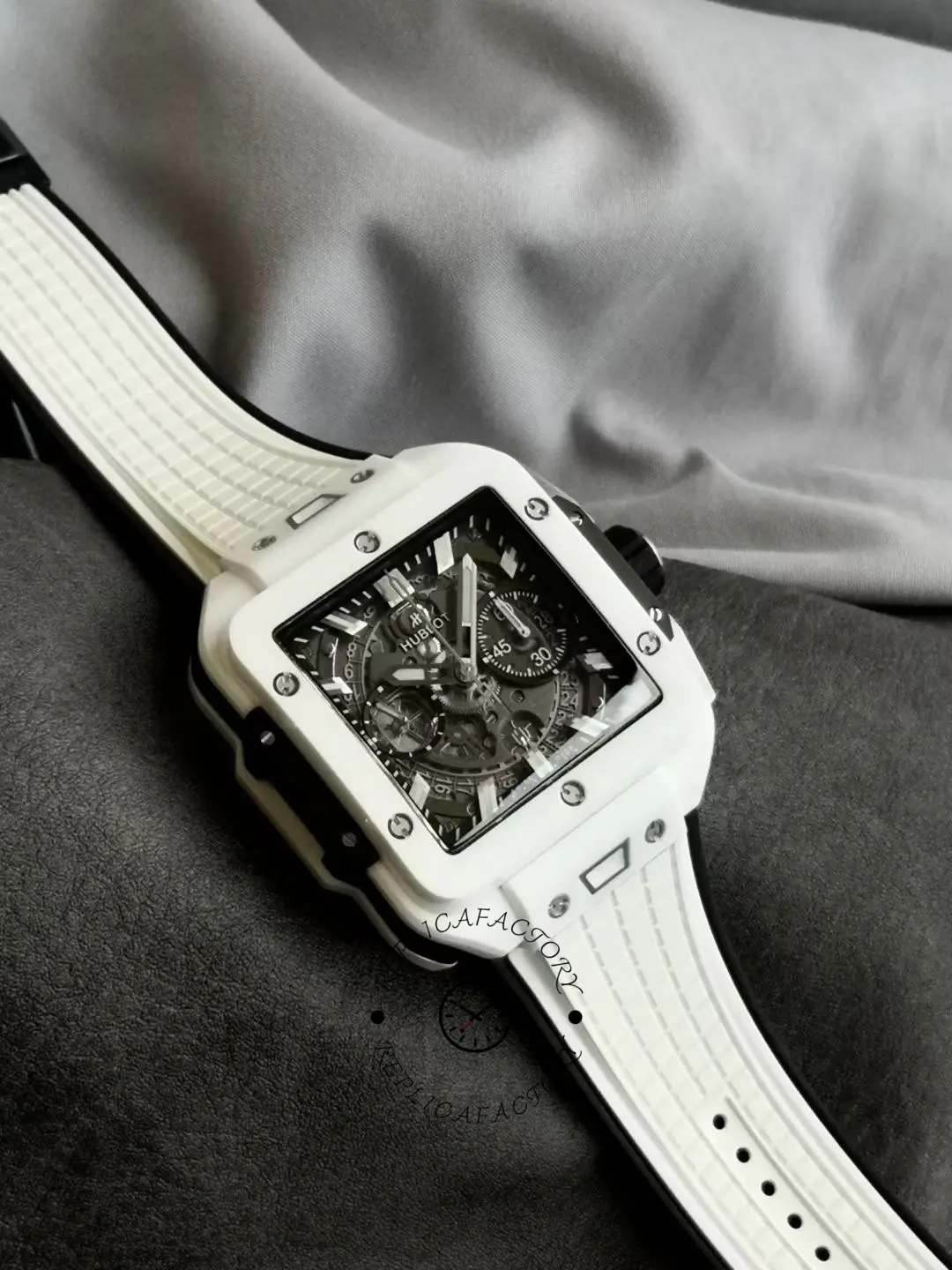 Angled flat-lay of Hublot Spirit of Big Bang 821.HX.0170.RX on fabric, dial and case edges.