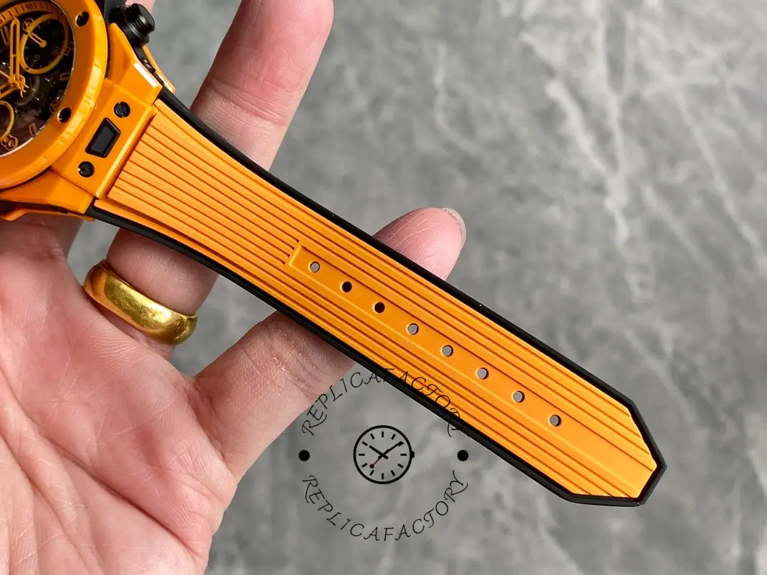 Strap holes detail of Hublot Big Bang Unico 441.CU.5910.RX, inner side of orange rubber strap.
