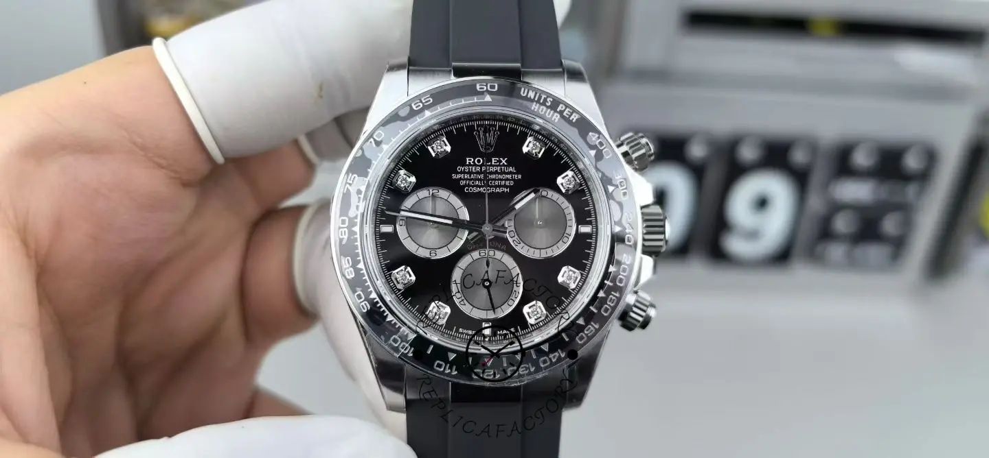 Front hand-held view of Rolex Daytona 126519LN-0004 with bright black dial, diamond markers, and black rubber strap.