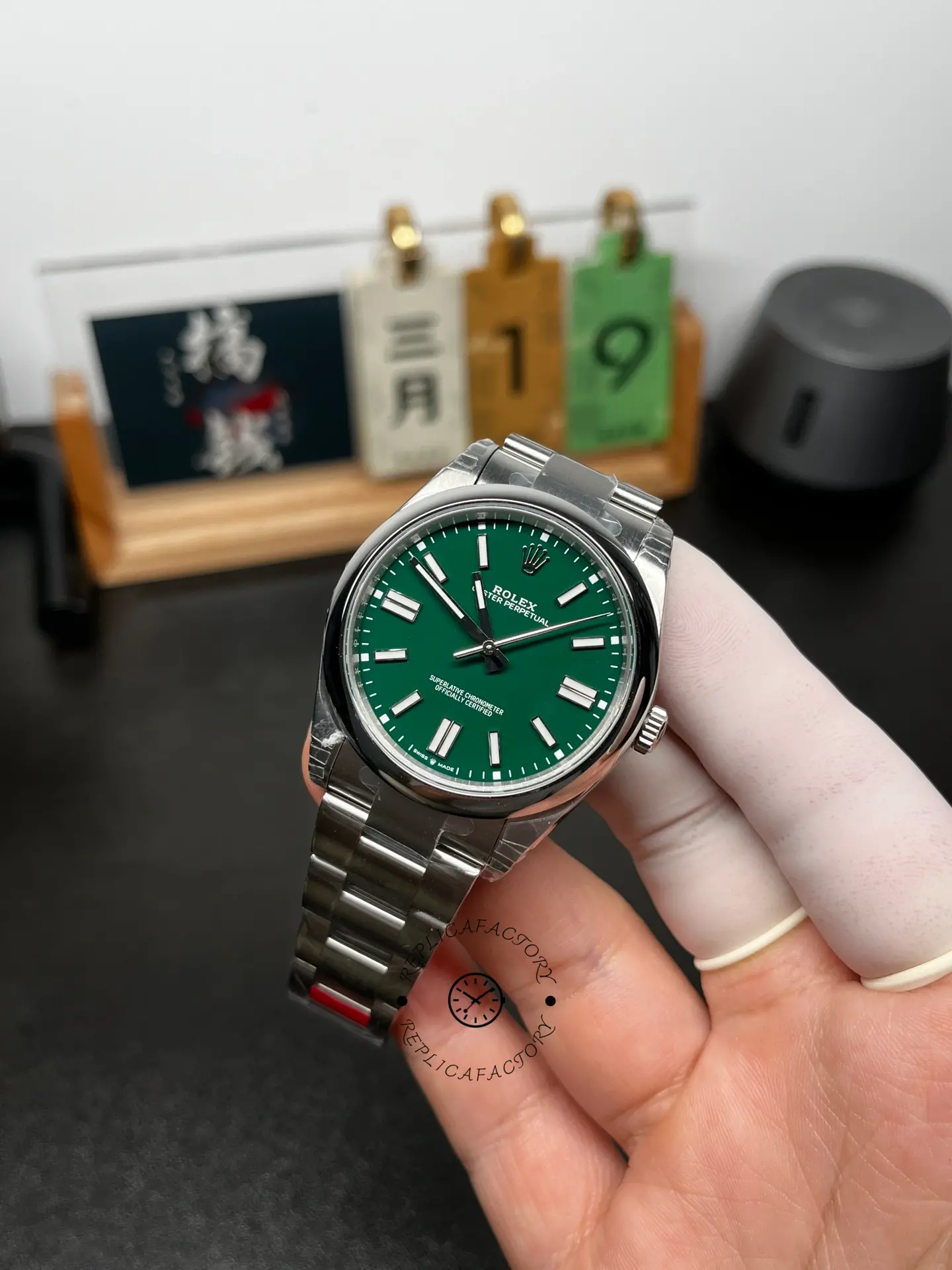 Angled front view of Rolex Oyster Perpetual 41 134300-0004 with green dial and Oyster bracelet.