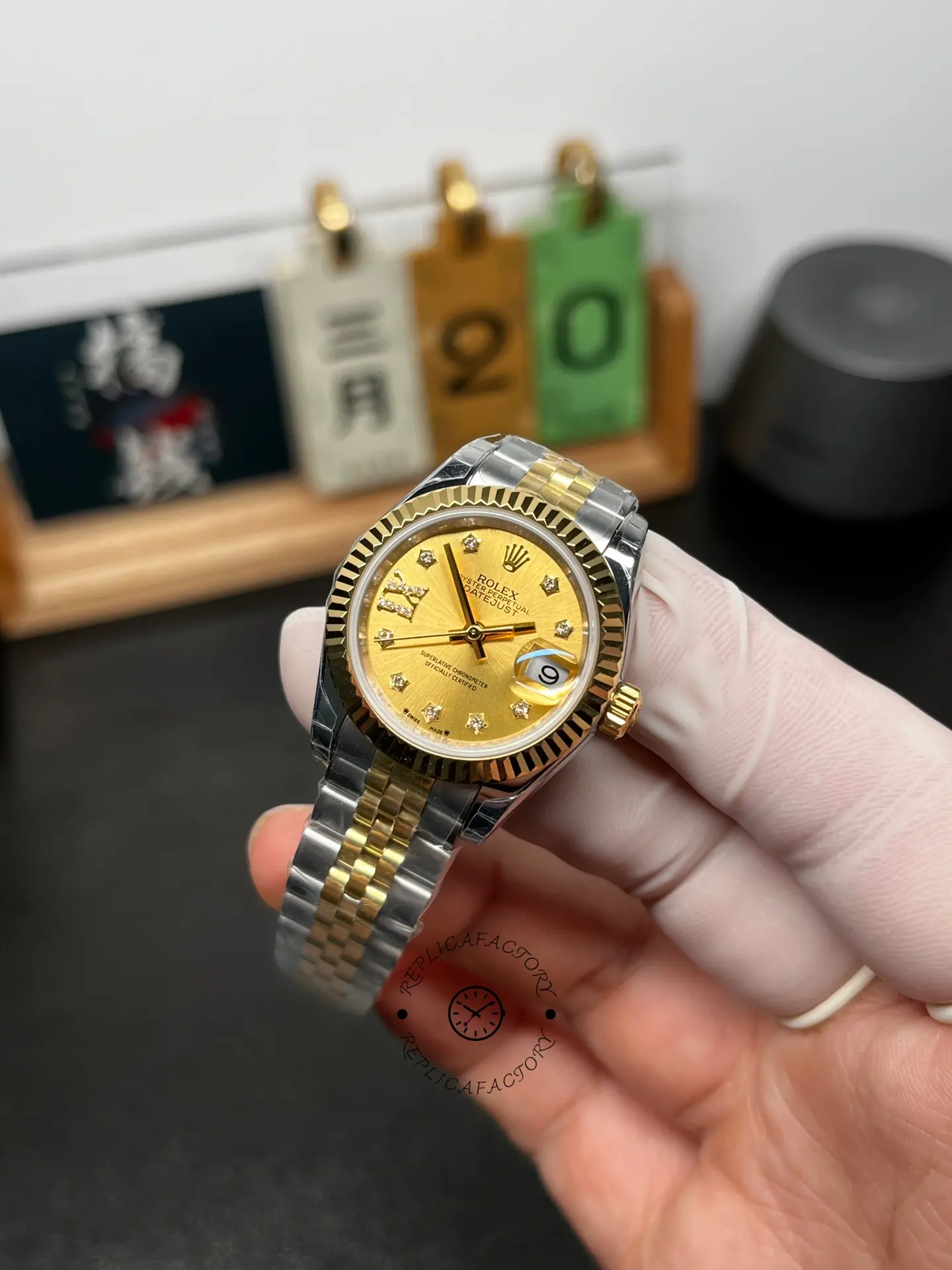 Angled front view of Rolex Lady-Datejust 279173-0021 showing the champagne dial and Roman VI diamond detail.