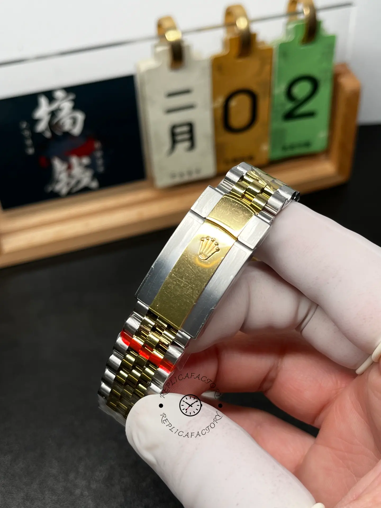 Clasp close-up of Rolex Datejust M126333-0012 showing the two-tone folding clasp with crown logo.