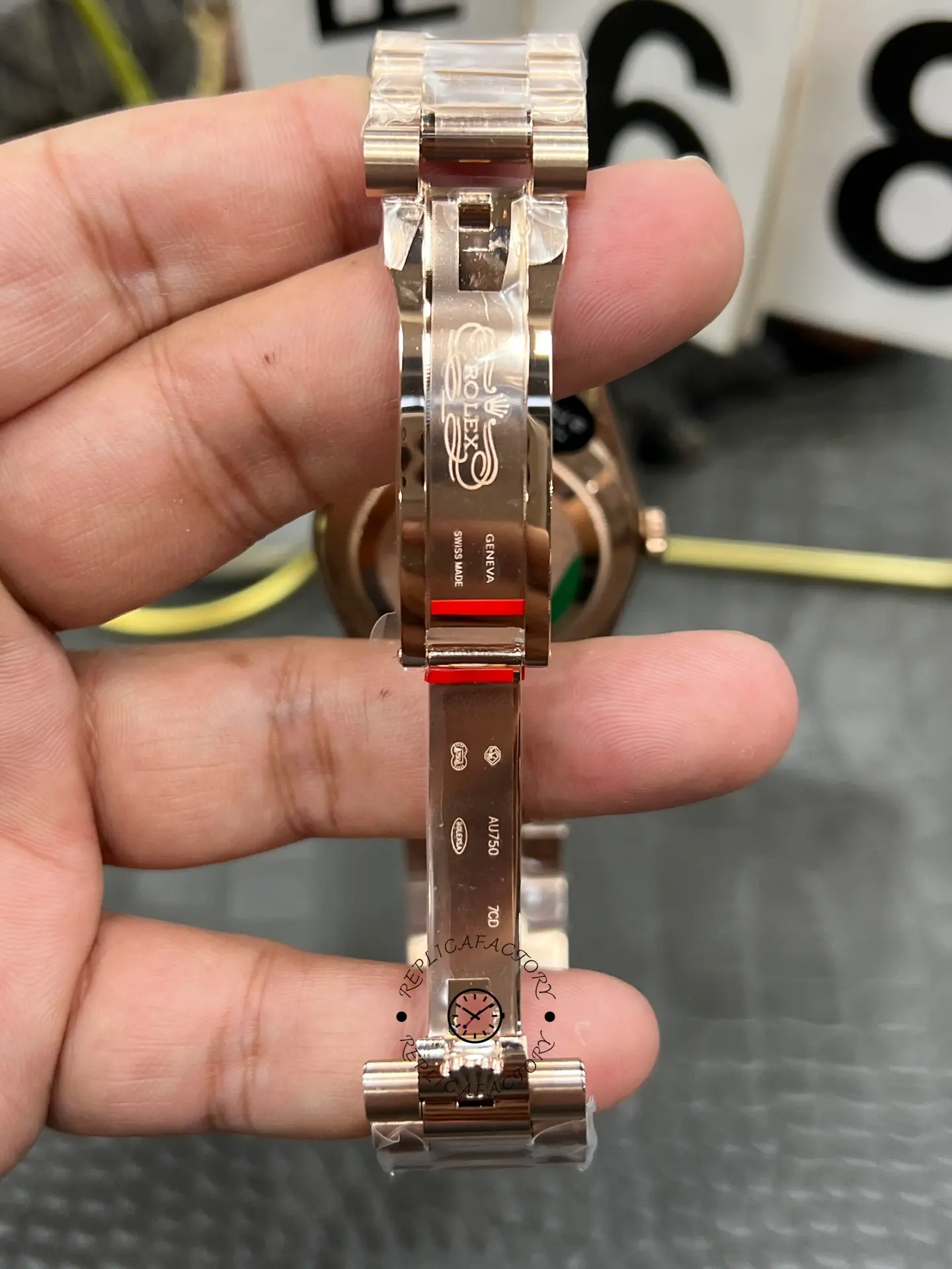 Open clasp interior view of Rolex Day-Date 40 M228235-0055 showing clasp engravings and folding mechanism.