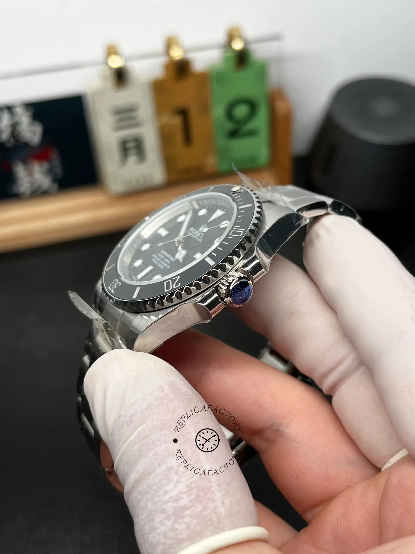 Side view of Rolex Submariner 124060 showing the black bezel, signed crown, and polished case profile.