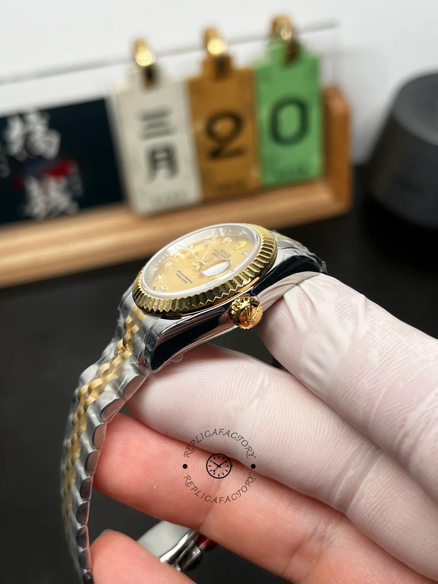 Side angle of Rolex Lady-Datejust 279173-0021 showing the fluted bezel, gold crown, and two-tone Jubilee bracelet.