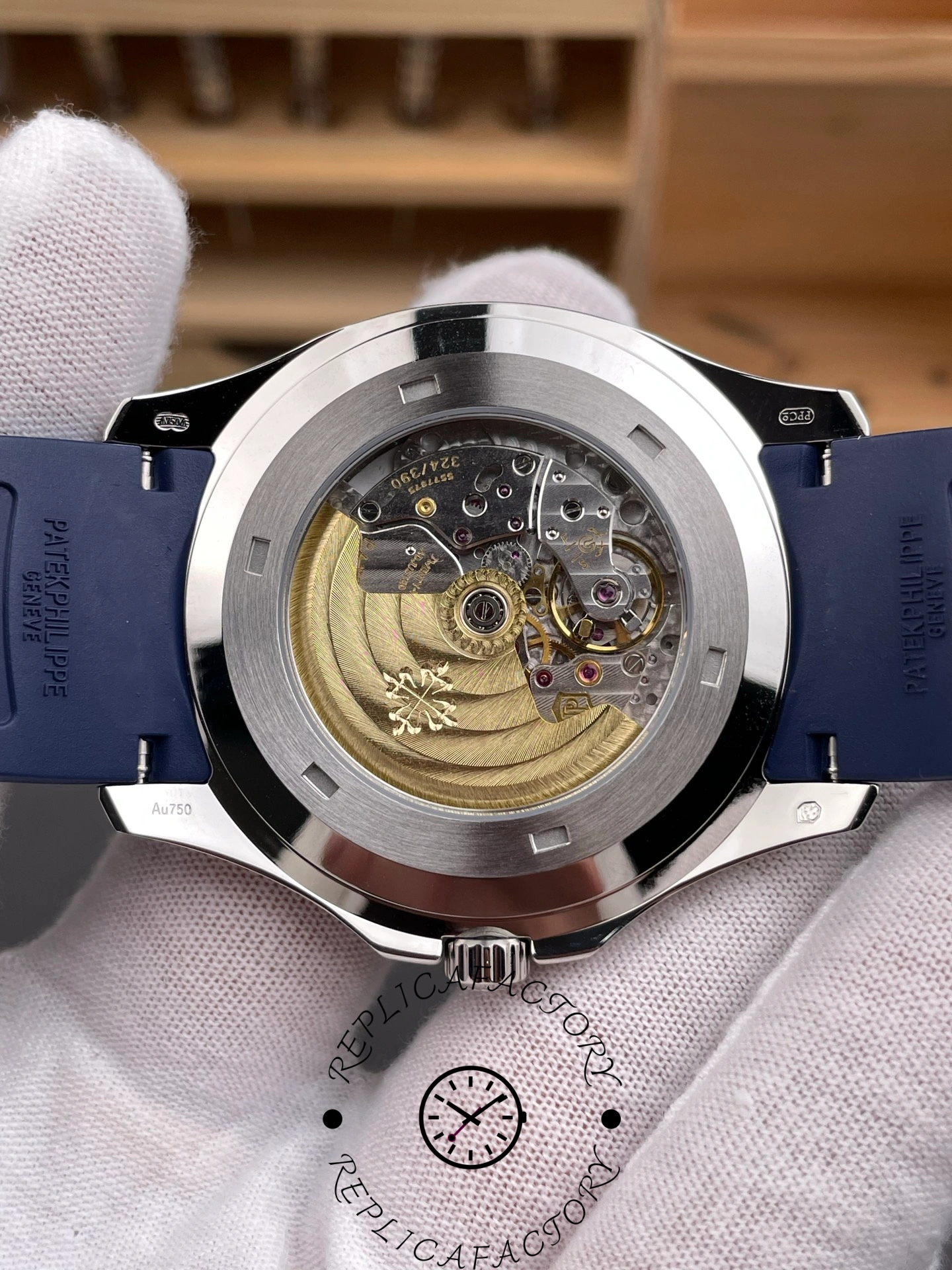 Transparent case back of Patek Philippe 5168G-001 1:1 clone showing automatic movement and rotor.