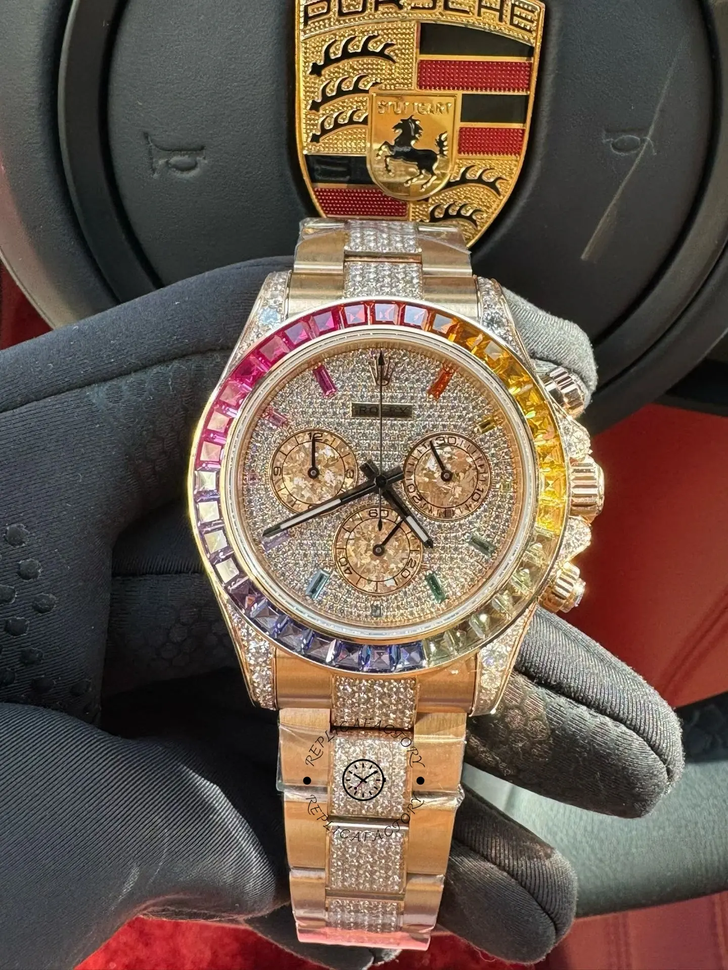 Front view of Rolex Daytona 116595RBOW-0002 showing rainbow bezel, pavé dial and rose gold bracelet.