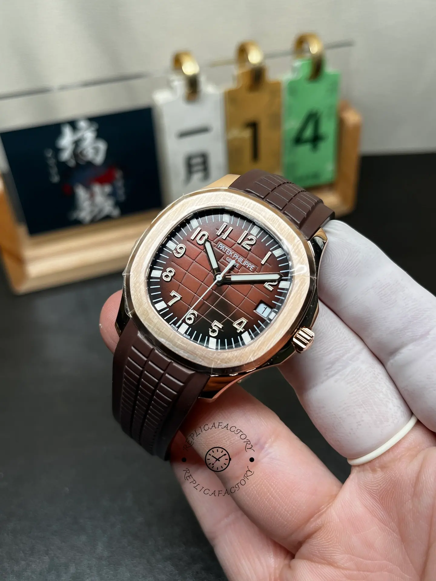 Patek Philippe Aquanaut 5167R-001 angle view, brown dial, date at 3 o’clock, rose-gold case.