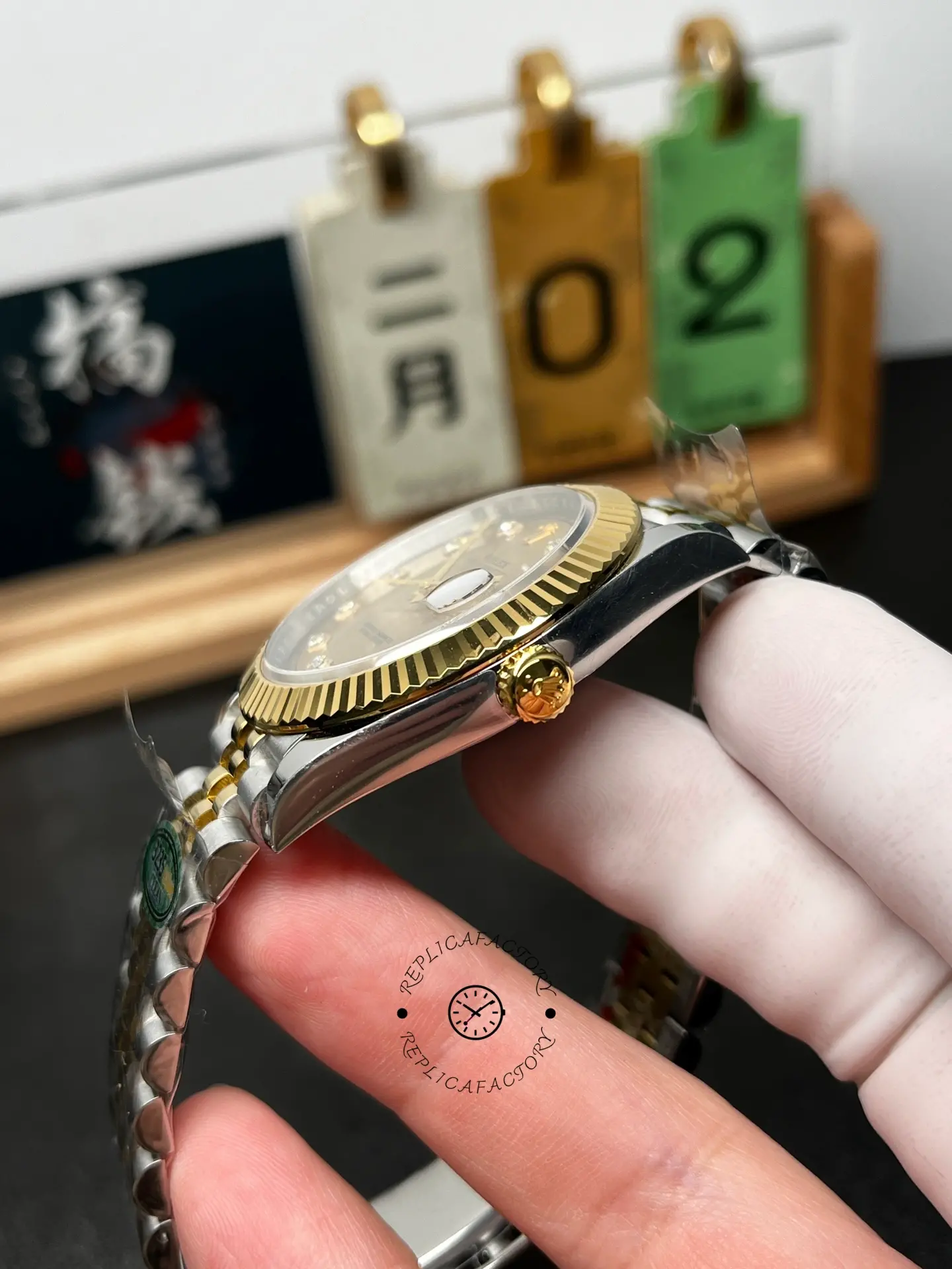 Side angle of Rolex Datejust M126333-0012 highlighting the fluted bezel edge and gold crown detail.