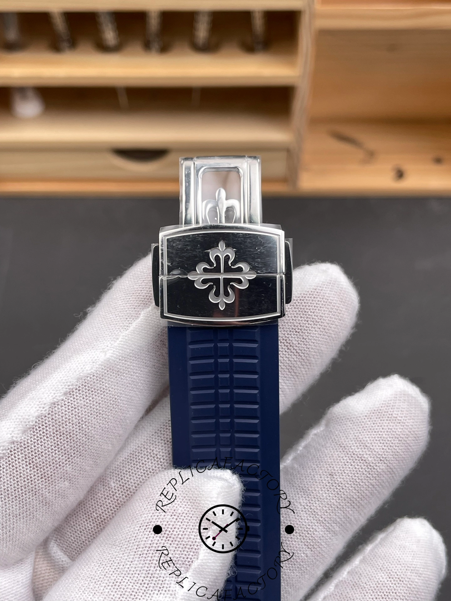 Clasp front view of Patek Philippe 5168G-001 1:1 clone with engraved logo on deployment clasp.