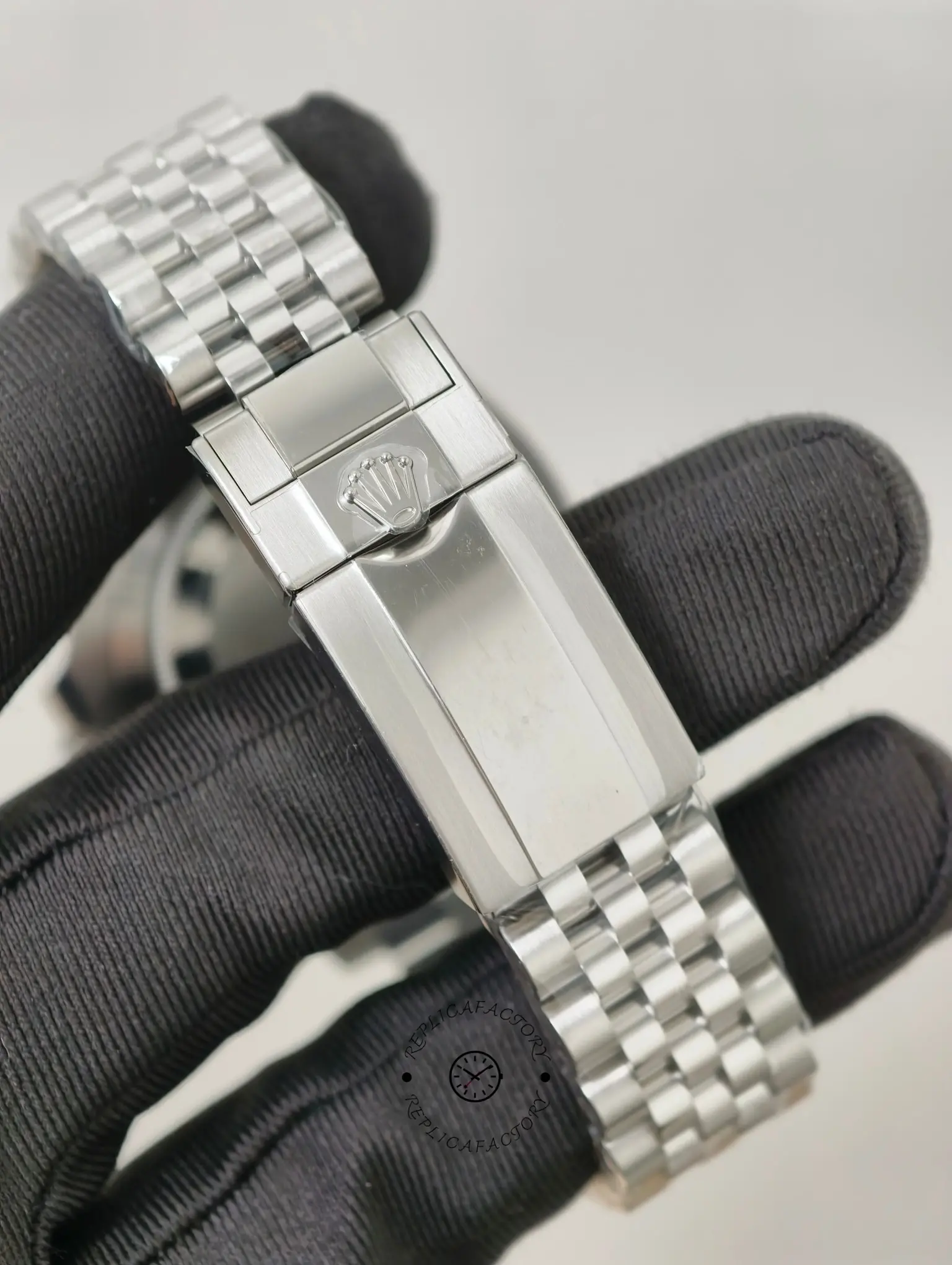 Clasp close-up of Rolex GMT-Master II 126720VTNR Jubilee bracelet with engraved Rolex-style crown logo.