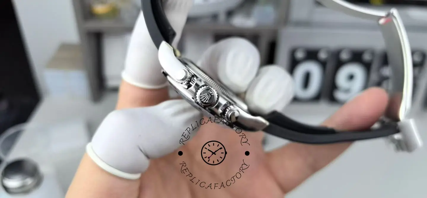 Crown-side profile of Rolex Daytona 126519LN-0004 showing screw-down pushers and black strap curve.
