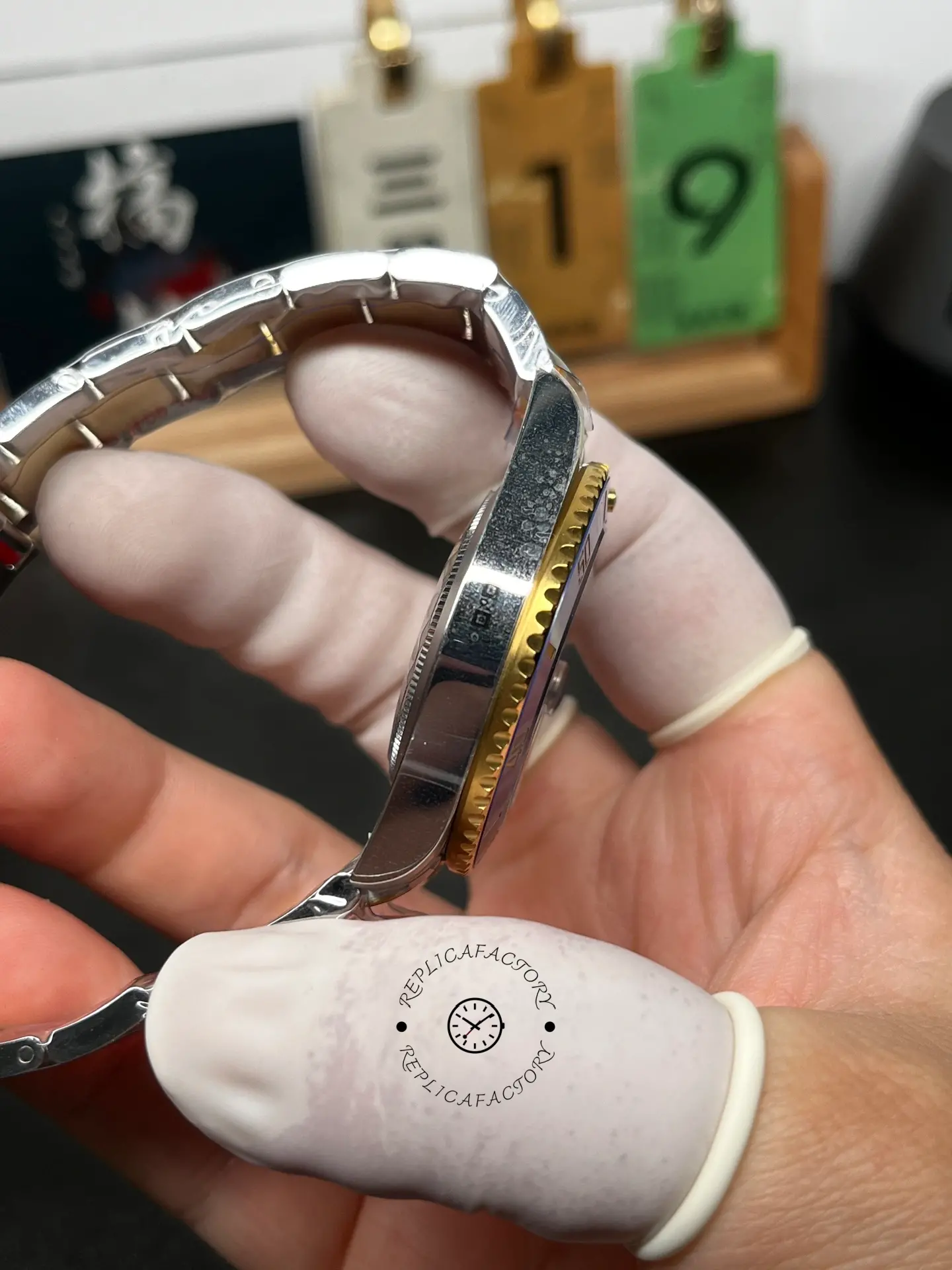 Side profile of Rolex Submariner 126613LB showing the case side, bezel edge, and bracelet curve.