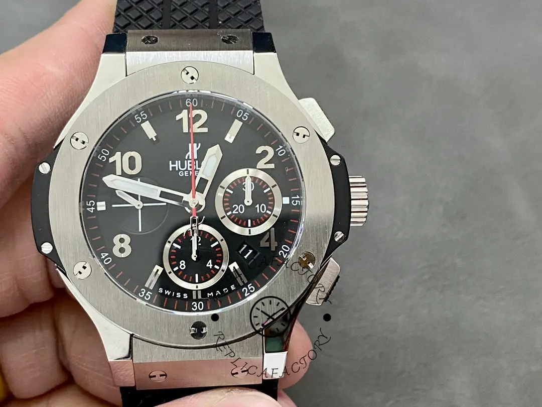 Front view in hand of Hublot Big Bang 301.SB.131.RX showing black dial and chronograph subdials.